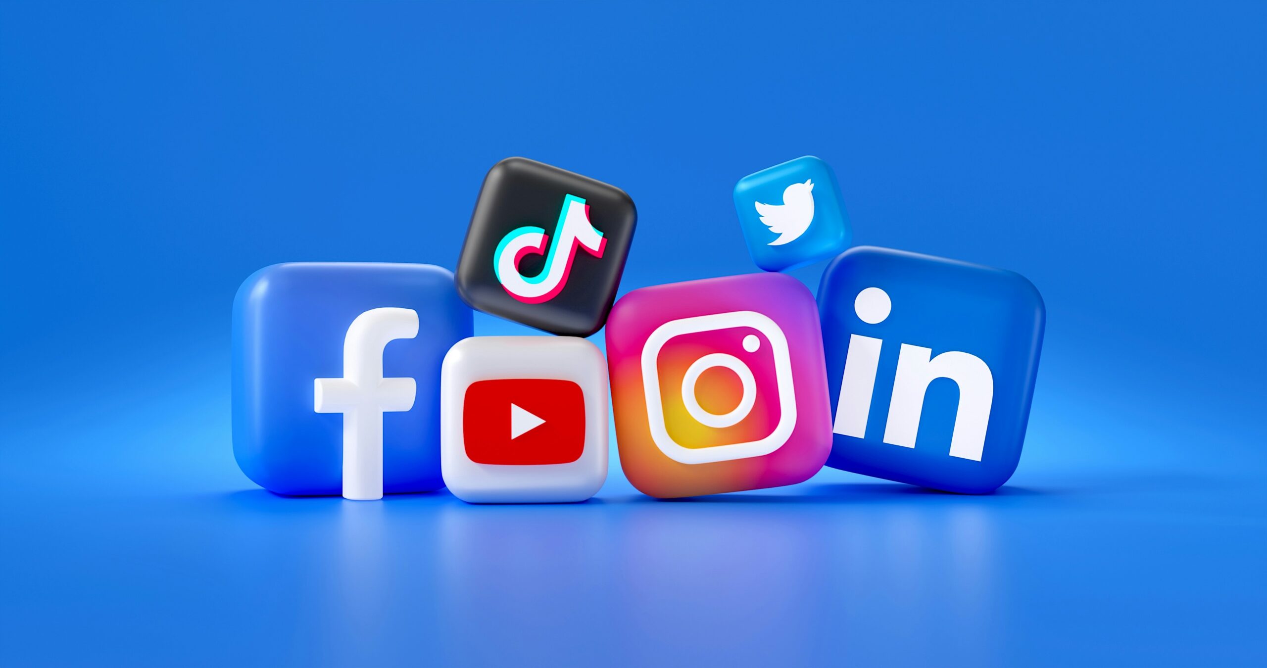Social media marketing platforms are represented by 3D symbols of Facebook, Instagram, LinkedIn, , YouTube, and Twitter.